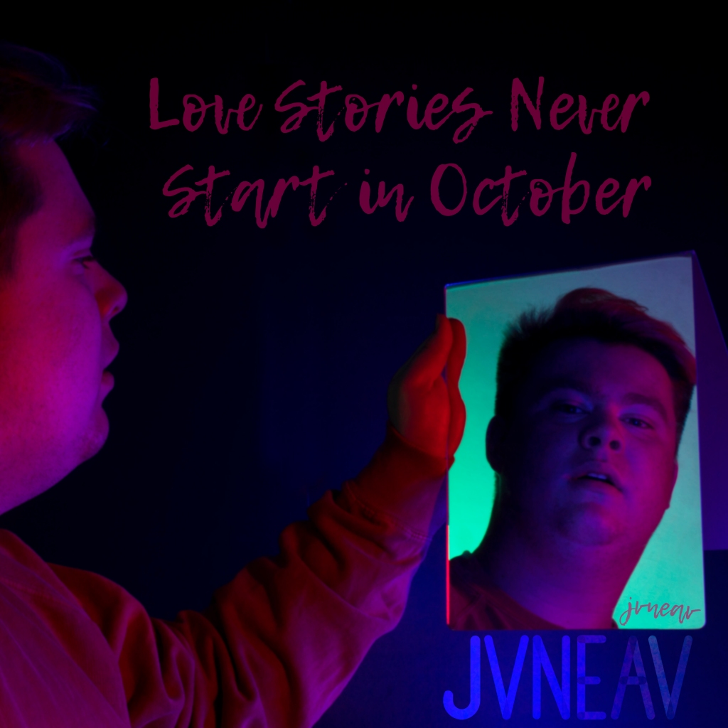 Jvneav in Red holding a mirror with a mint background with the title of the album above it and the logo underneath.